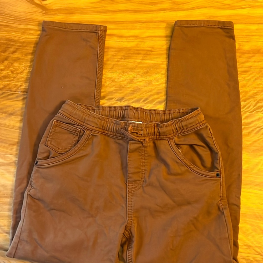 Rust colored drawstring khaki pants.